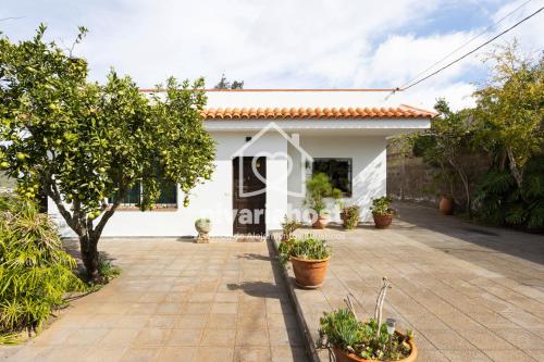 a villa with a pool and a house for sale at Tegas: Tacoronte, by Nivariahost in Tacoronte