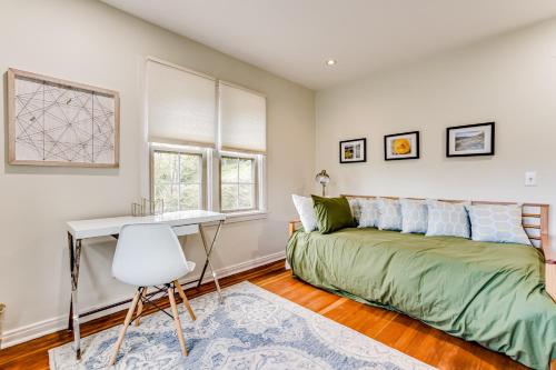 a bedroom with a bed and a desk at Villa Roma in Eugene