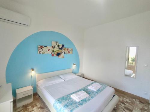 Postel nebo postele na pokoji v ubytování Gardenia Rooms