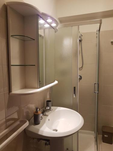 a bathroom with a sink and a shower at SANT'ALESSIO_BAY in Santa Margherita-Sant'Alessio Siculo