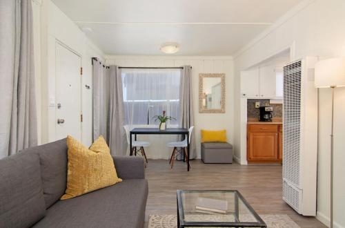 a living room with a couch and a table at Mission Bay Cottage - Bay View Patio, Parking, WasherDryer in San Diego