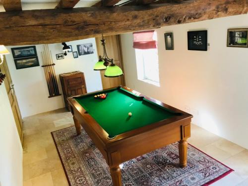 an overhead view of a pool table in a room at ROUGE COTTAGE Gîte 4 étoiles Billard in Gueutteville-les-Grès