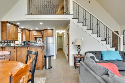 a kitchen and a living room with a couch and a table at Buckhead Home with On-Site Lake Oconee Access! in Eatonton 