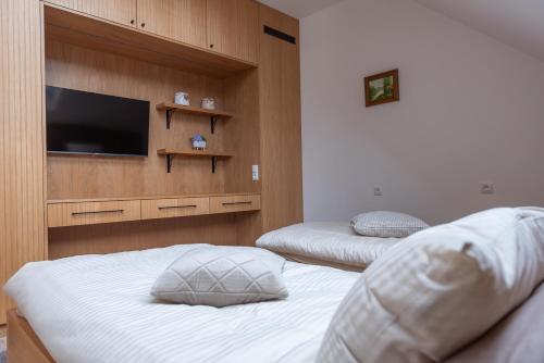 Ένα ή περισσότερα κρεβάτια σε δωμάτιο στο Apartamenty Borycz