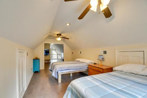 a bedroom with two beds and a ceiling fan at Buckhead Home with On-Site Lake Oconee Access! in Eatonton 