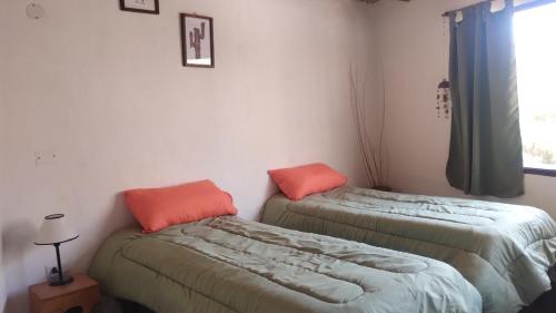 Una cama o camas en una habitación de Cabañas APU