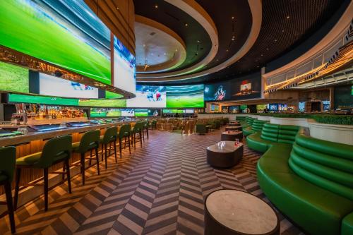 a bar with green seats in a casino at Durango Casino & Resort in Las Vegas