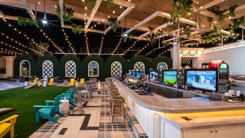 a large room with a bar with chairs and tables at Durango Casino & Resort in Las Vegas