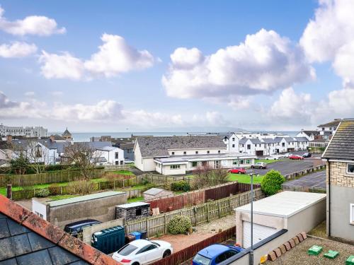 a view of a city with buildings and cars at Portstewart Central Loft Apartment in Portstewart
