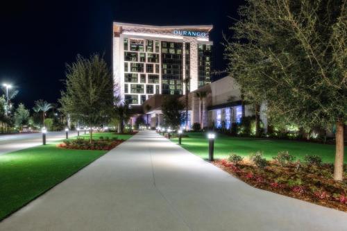 a walkway in front of a building at night at Durango Casino & Resort in Las Vegas