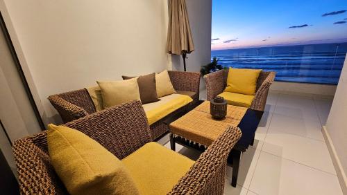 a living room with a couch and chairs and a table at Magnifique vue, charme unique. in Kenitra