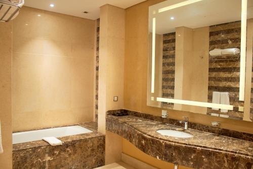 a bathroom with a sink and a mirror at Tolip Resort El Galala Hills in Ain Sokhna