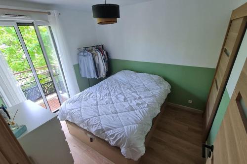 Gulta vai gultas numurā naktsmītnē Appartement Cosy