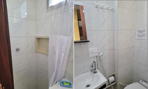 ein Bad mit einer Dusche, einem Waschbecken und einem WC in der Unterkunft My Home 2 quartos em Cobertura ao lado da praia in Rio de Janeiro