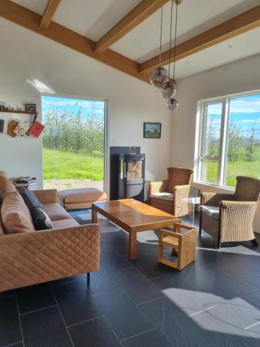 a living room with a couch and a table at Kambar in Selfoss