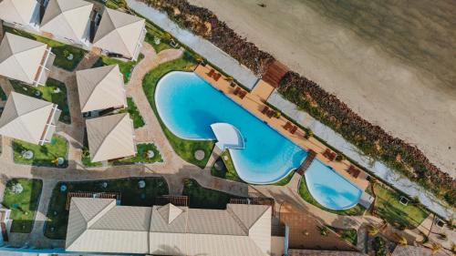 an aerial view of a resort with a swimming pool at Oiti Beach Resort Tutoia in Tutóia