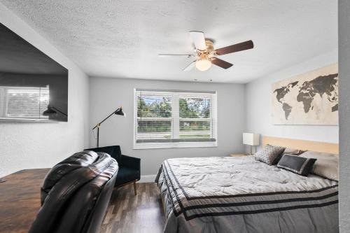 a bedroom with a bed and a ceiling fan at Ultimate Private Home with Heated Pool in Sarasota