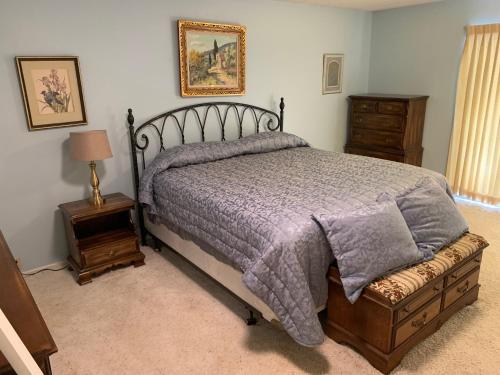 a bedroom with a bed with a purple comforter at Stay near Beautiful San Felipe Creek. in Del Rio