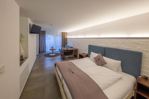 Postel nebo postele na pokoji v ubytování Hotel Schäfli Siebnen