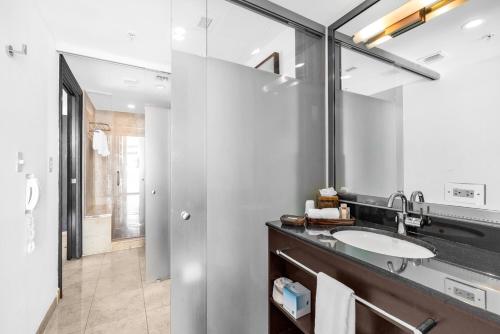 a bathroom with a sink and a mirror at Suites Ocean Drive Hotel in Miami Beach