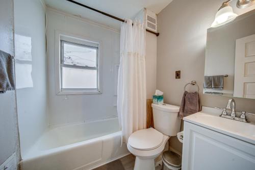 a bathroom with a toilet and a sink and a shower at Pet-Friendly Cleveland Townhome, 2 Mi to Downtown! in Cleveland