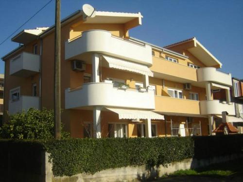 a large building with balconies on the side of it at Apartment Lala in Kaštela