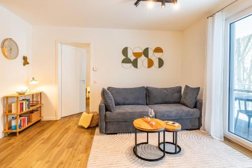 a living room with a couch and a table at Apartment "Haff Ahoi" - Haffresidenz in Garz