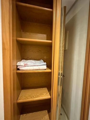 a wooden closet with a towel in it at STUDIO DE LUX A BOURGOGNE in Casablanca