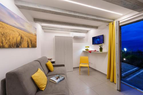 a living room with a couch and a window at Holidays Homes The dream in Sant'Agnello