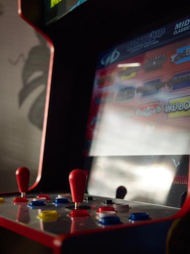 a close up of a video game controller at 2-bed near Gloucester & Cotswolds - 2x parking, desk, fibre, arcade in Gloucester