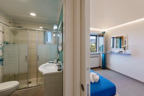 a bathroom with a shower and a toilet and a sink at Holidays Homes The dream in Sant'Agnello