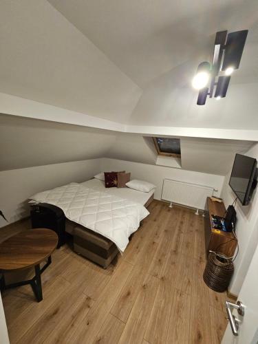 Ένα ή περισσότερα κρεβάτια σε δωμάτιο στο Apartmani Novak