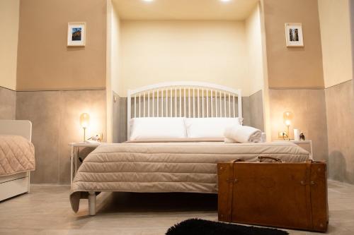 Postel nebo postele na pokoji v ubytování Graziano Home Station