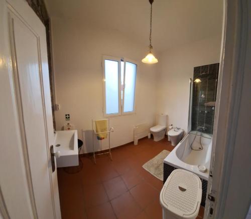 a bathroom with two toilets and a sink at Valentina's House in Porto da Cruz