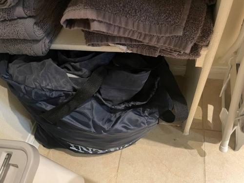 a bag sitting on the floor in a closet at Luxury 2 bedroom apartment in downtown LA! in Los Angeles