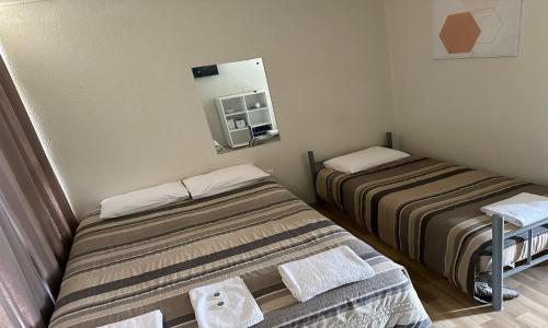 Postel nebo postele na pokoji v ubytování St George Hotel Motel