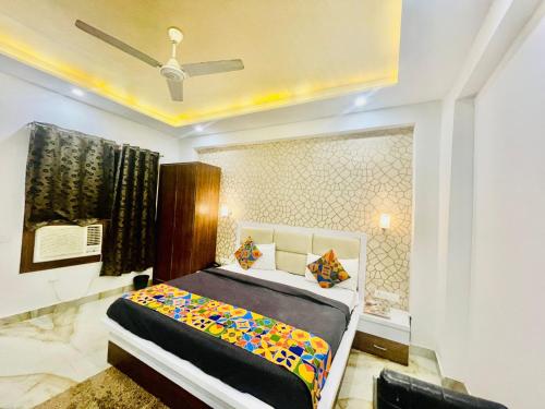 a bedroom with a bed and a window at Hotel Taj Star by Urban stay in Agra