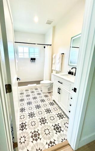 a bathroom with a toilet and a sink at New Haven Inn in Solvang