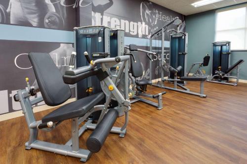 a gym with several tread machines in a room at Drury Plaza Hotel Columbia East in Columbia