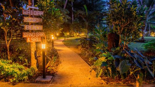 a street sign on a dirt road at night at Koro Sun Resort & Rainforest Spa in Savusavu