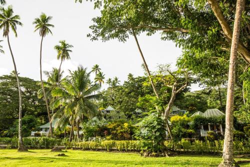 a view of a resort with palm trees at Koro Sun Resort & Rainforest Spa in Savusavu