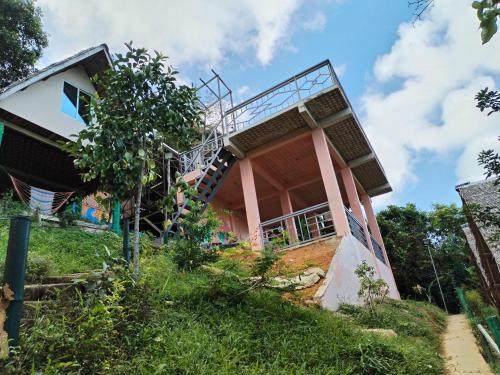 a house on the side of a hill at Forest Camp El Nido in El Nido