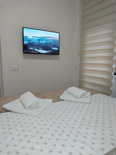 Postel nebo postele na pokoji v ubytování Lider Lux Apartman