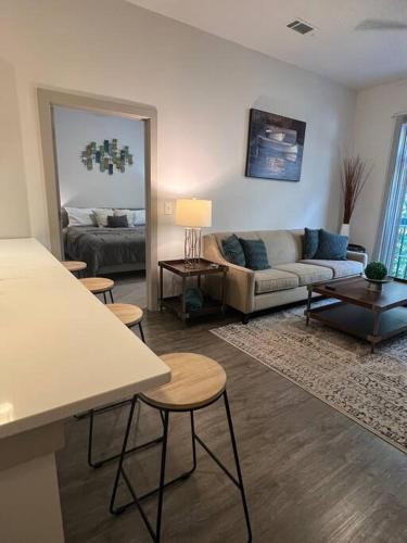 a living room with a couch and a table at Luxury Executive 2 Bedroom/2 Bathroom Boutique Apt in Charlotte
