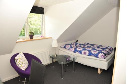 Tempat tidur dalam kamar di Herning Bed & Breakfast