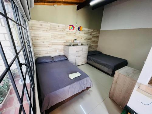 Ένα ή περισσότερα κρεβάτια σε δωμάτιο στο Casa campestre los cerezos