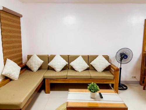 a living room with a couch and a table at 2 Bedroom Townhouse- Near Clark Airport in Angeles