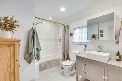 a bathroom with a sink and a toilet and a tub at Colorado Springs Home Balcony with Mountain Views! in Colorado Springs