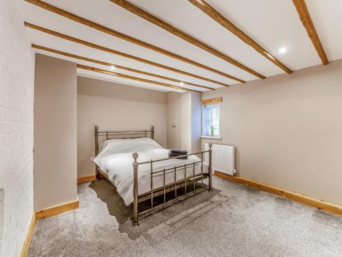 En eller flere senge i et værelse på Rod Line Cottage