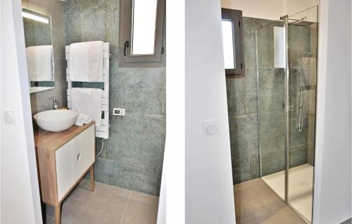 a bathroom with a sink and a glass shower at La Maison Adriel in Saumane-de-Vaucluse